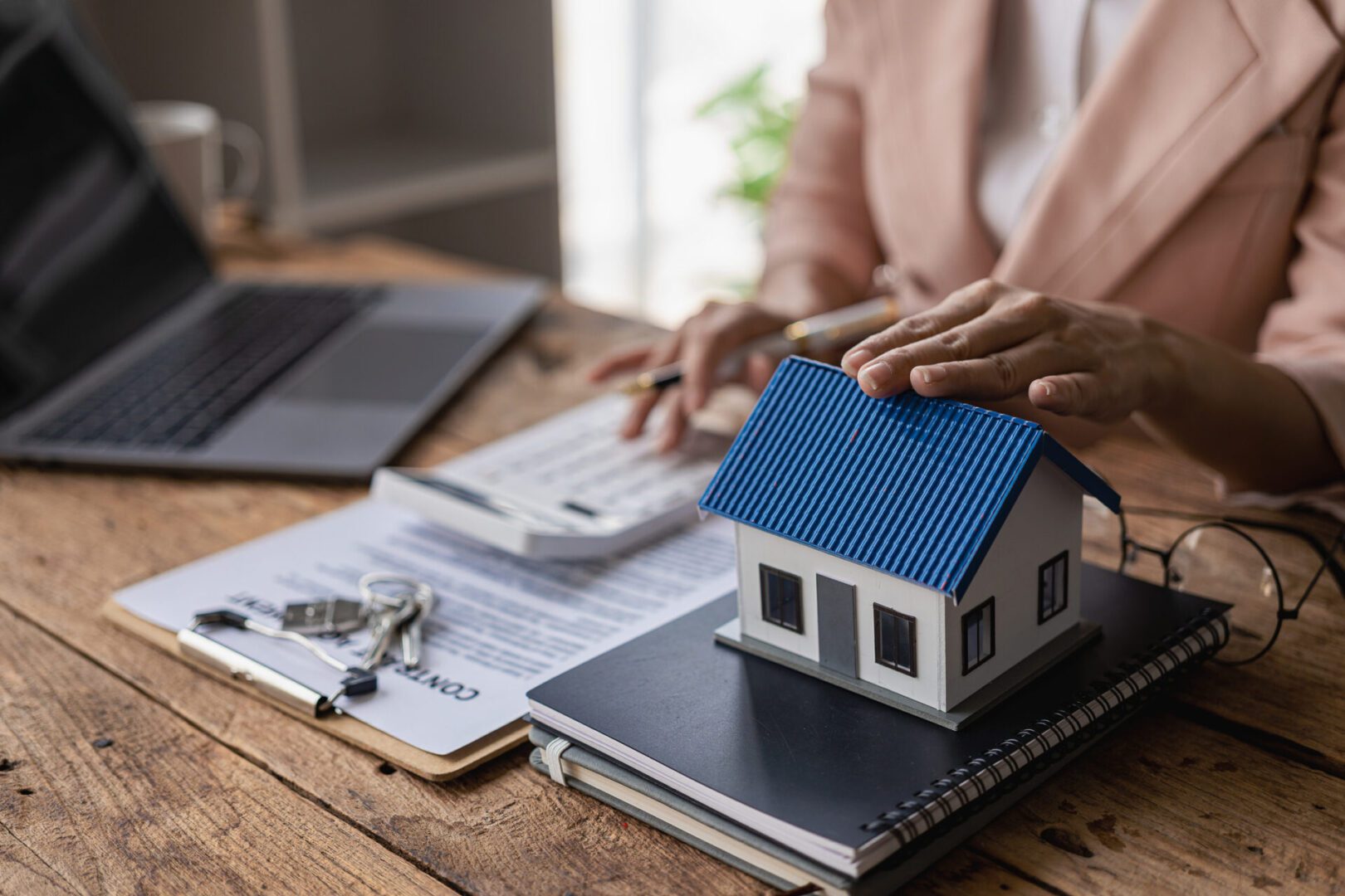 Real estate concept with mini house model